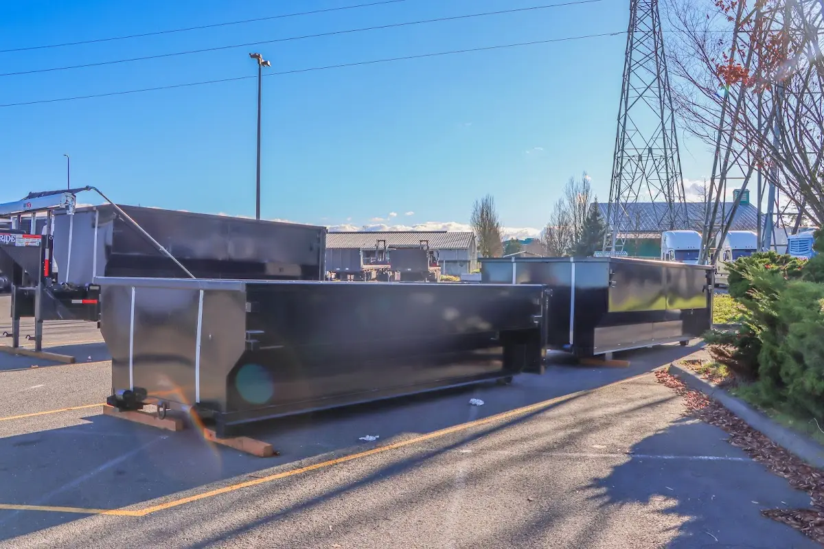 Roll-off dumpster ready for waste disposal at job site for 15 Yard Dumpster Rental in Beverly